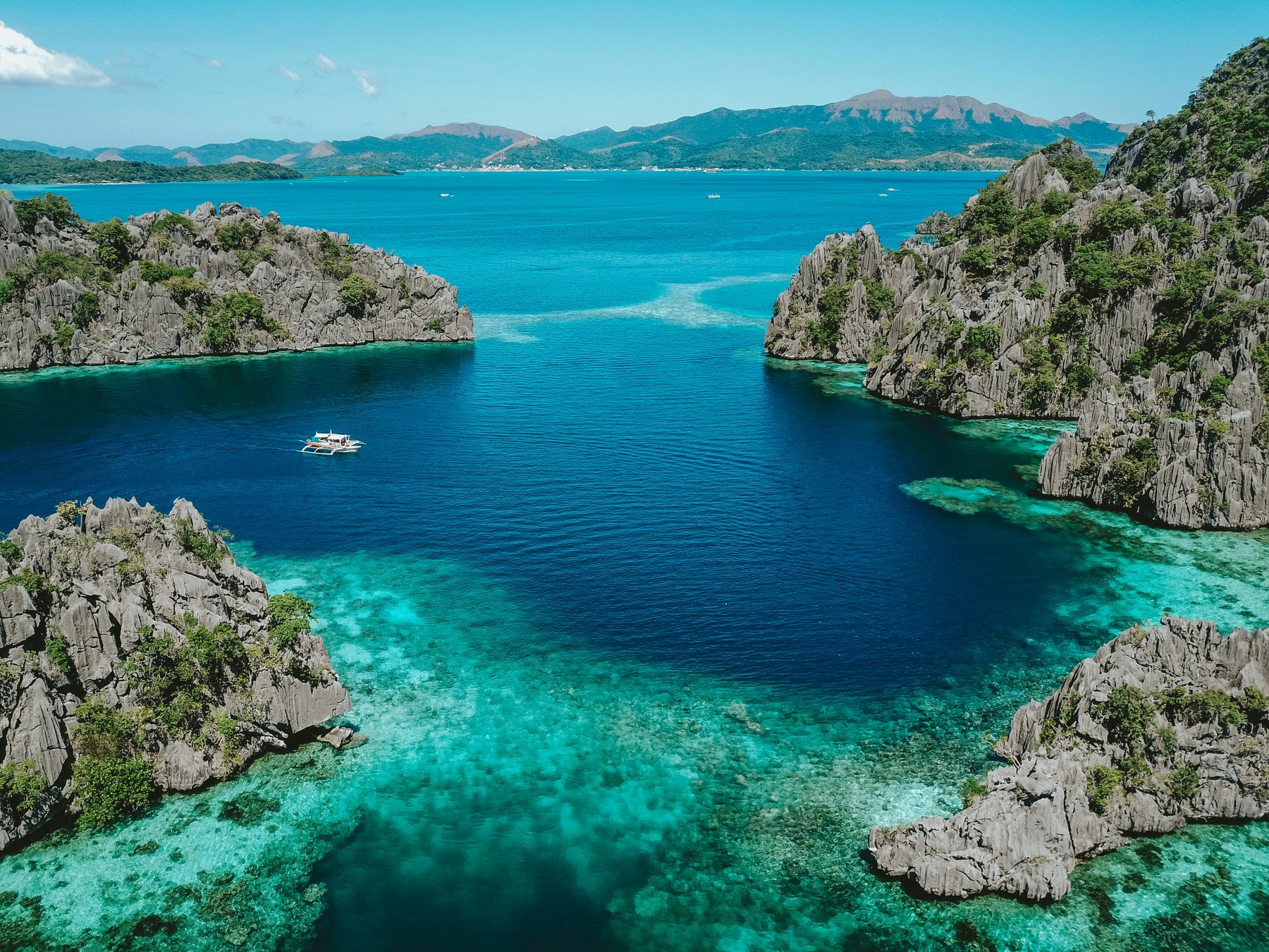 Aerial view of islands and turquoise water in the Philippines